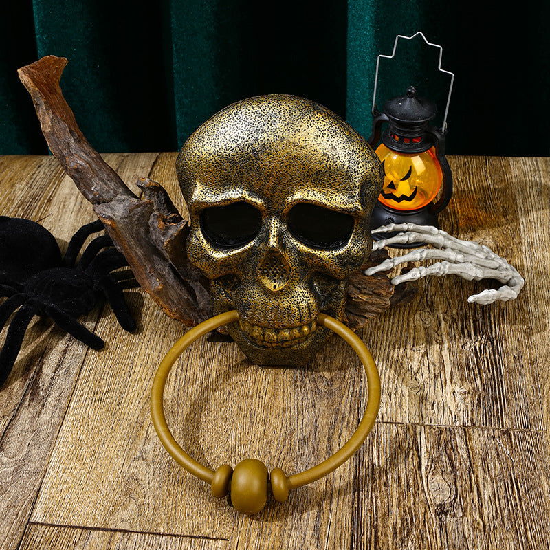 Sonnette de porte avec squelette et crâne