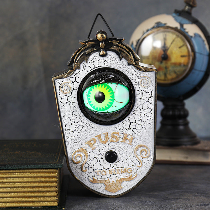 Sonnette de porte avec globe oculaire effrayant