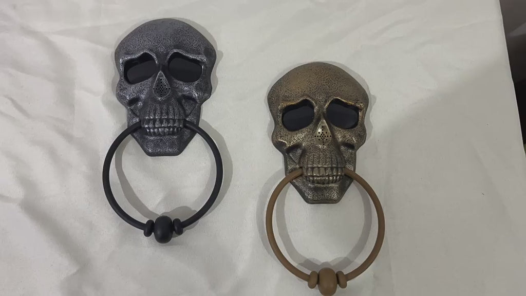 Sonnette de porte avec squelette et crâne
